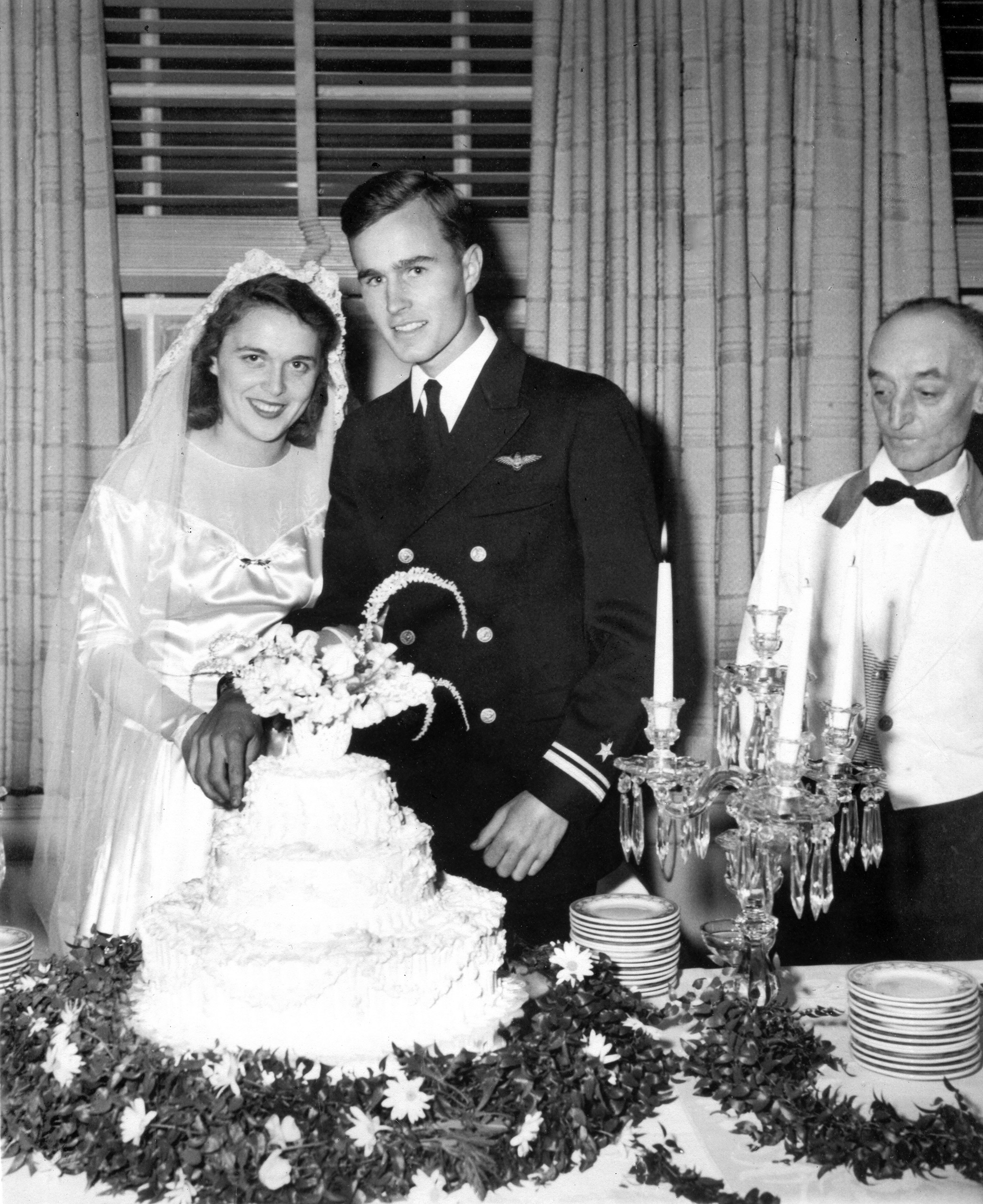 HS767 George and Barbara Bush cut their wedding cake, Rye, New York. 06 January 1945 Photo Credit: George Bush Presidential Library and Museum
