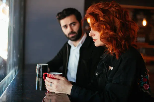 Upset couple in cafe