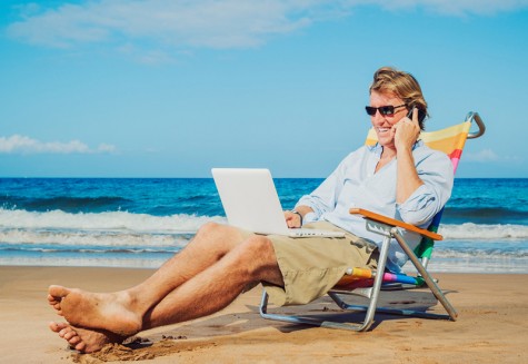 Young Business Man Working Remotely on Tropical Beach